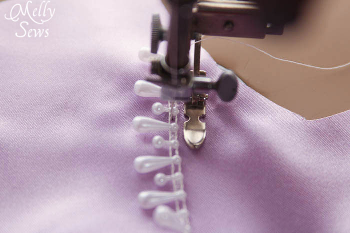 Sewing beaded trim on Inspired by Princess Sofia the First Dress Tutorial - Melly Sews