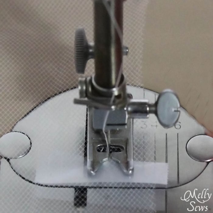 Transparent Tape on your presser foot helps prevent tulle snags - Melly Sews
