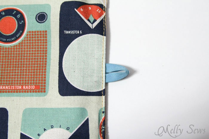 STep 8 - insert loop of elastic for button, then sew 3 edges closed - Book Style iPad Case Tutorial by http://mellysews.com