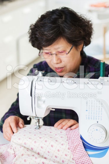 stock-photo-39744788-housewife-and-sewing-machine