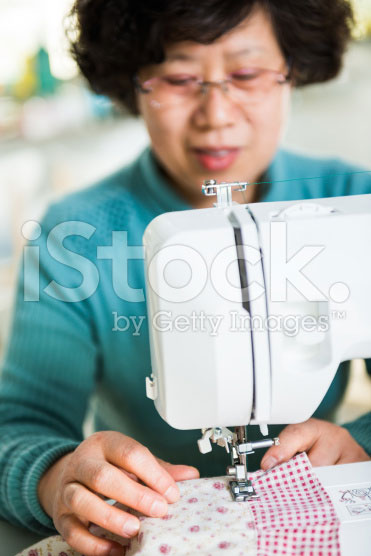 stock-photo-39822538-housewife-and-sewing-machine