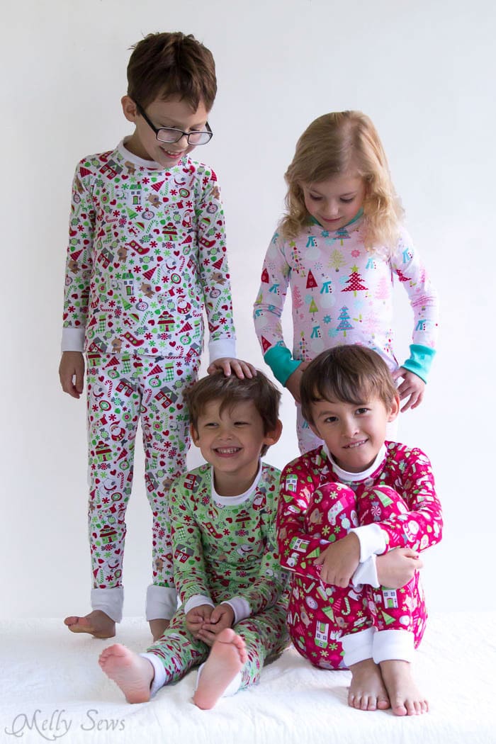 Sweet cousins on Christmas morning - DIY Sew knit kids Christmas pajamas - with FREE pattern! - Melly Sews