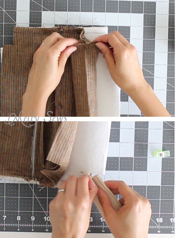 Step 6 hands demonstrating how to cut and fold fabric to box the corners of a toiletry bag 