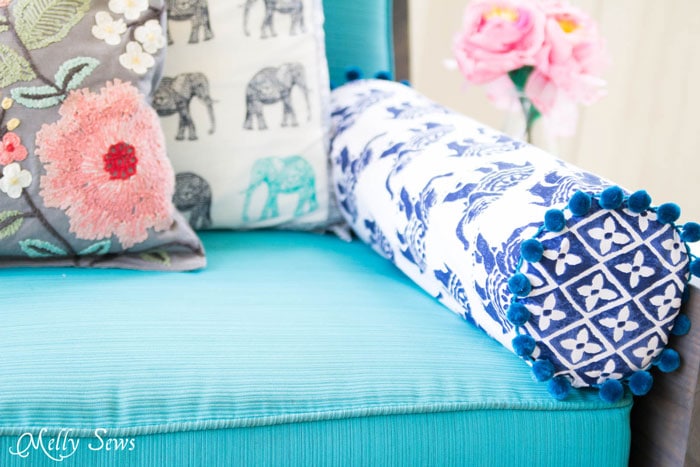 Sew a Bolster Pillow - Bolster Pillow Tutorial - Love this Boho Style pillow with pom pom trim! - Melly Sews