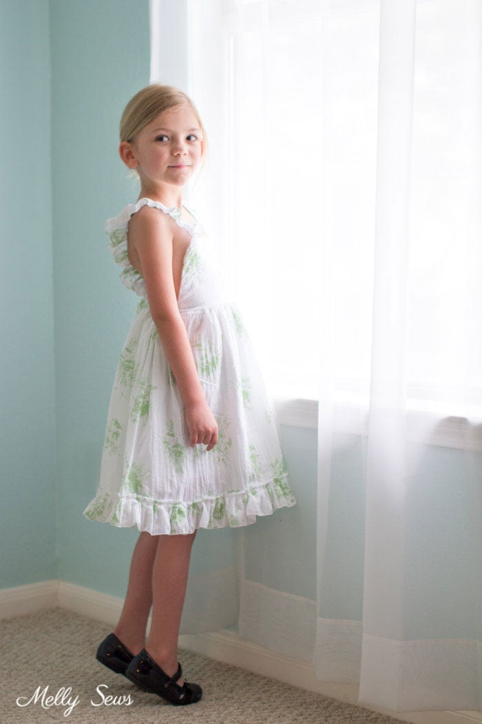 Pretty girls sundress - Sew a Ruffle Strap Pinafore Dress - Apron Dress for Girls - with free pattern and video tutorial on Melly Sews