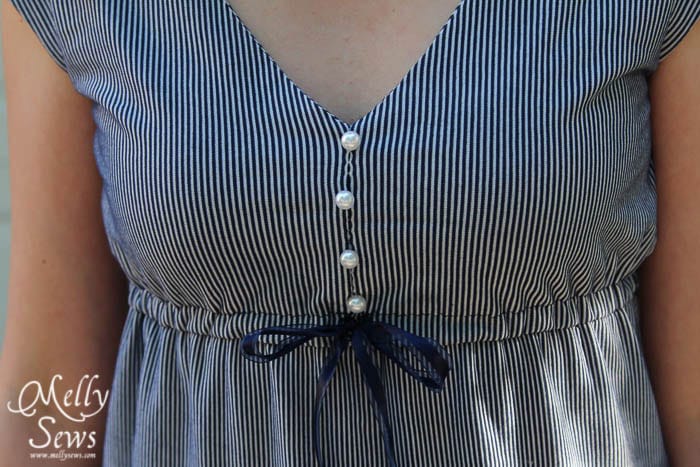 Close up of a V-neck maxi dress with high gathered waist