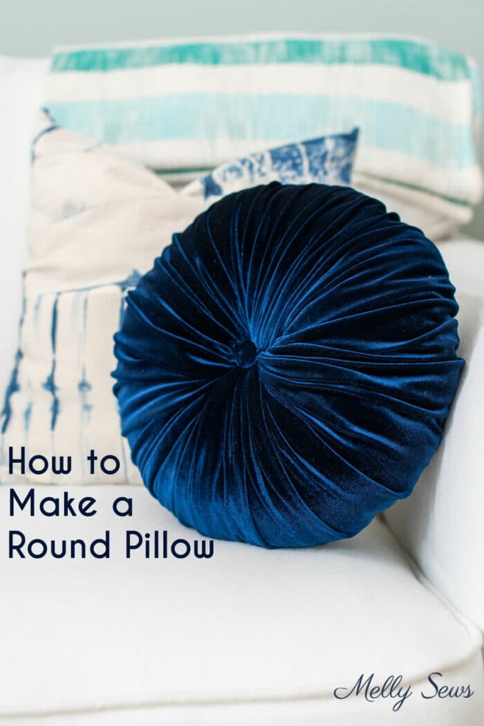 Navy blue velvet pillow with text How to Make a Round Pillow 