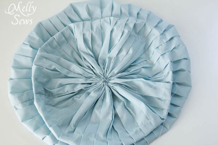 Gathering pleated fabric into a round shape
