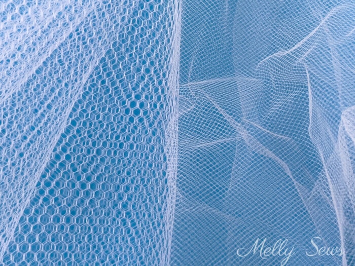 Two different types of tulle mesh fabric - stiffer fabric with larger holes and softer fabric with smaller holes