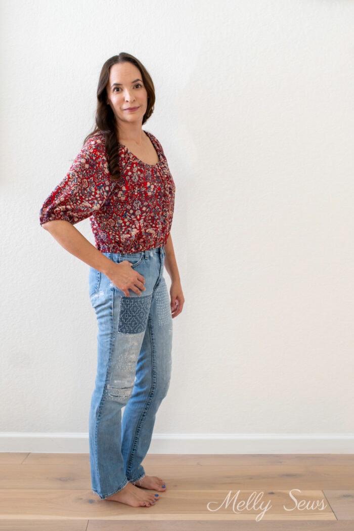Woman in a peasant top and jeans outfit