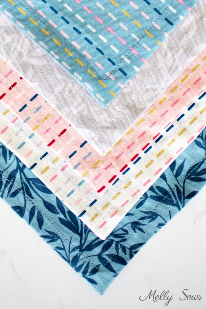 Mitered corner points of 5 sewn cloth napkins