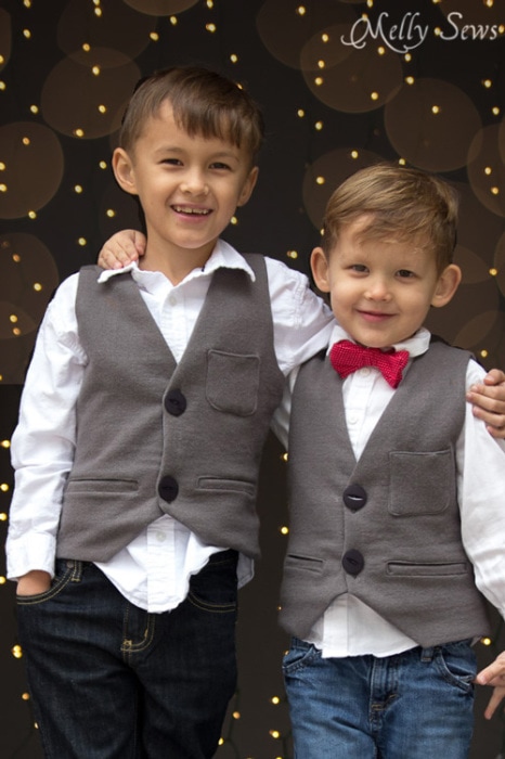Boys wearing holiday vests sewn by mom
