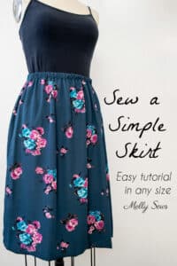 Blue skirt with pink and aqua flowers on a dress form with text Sew a Simple Skirt Easy tutorial for any size