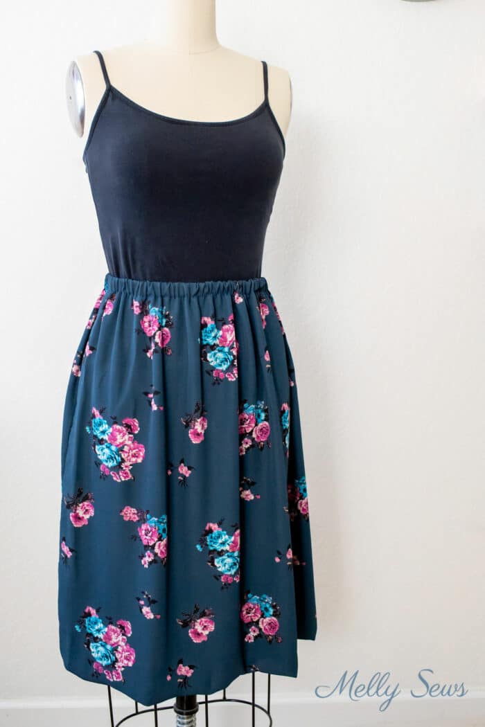 Blue floral skirt and black camisole on a dress form