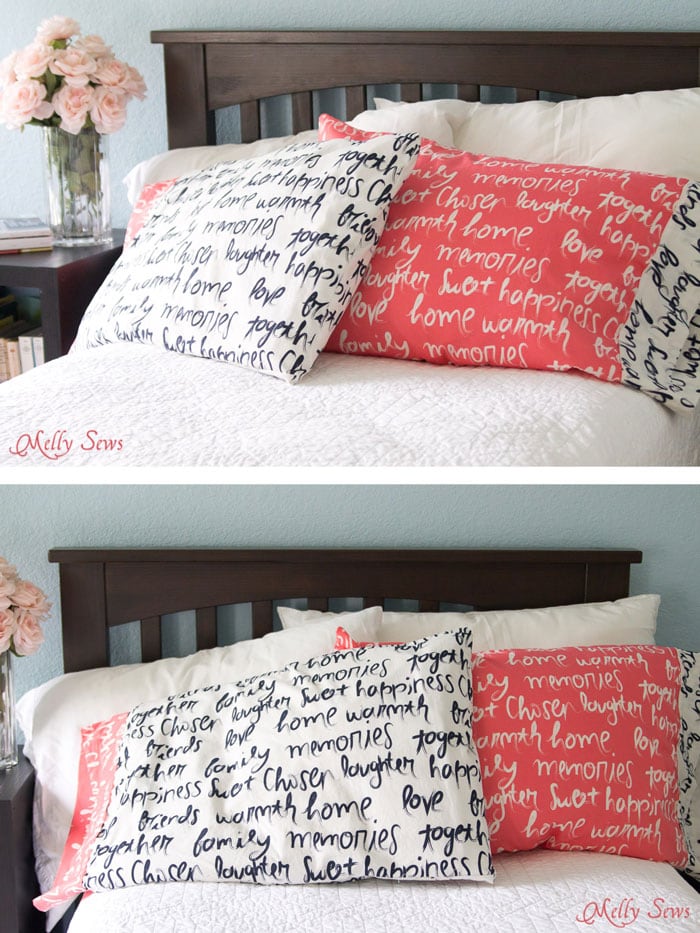 A white pillowcase with navy blue cursive text and a coral pillowcase with white cursive text on a bed