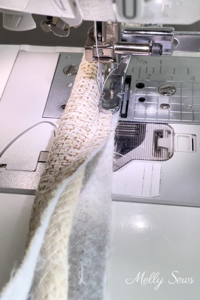 Cording being turned into piping on a sewing machine 