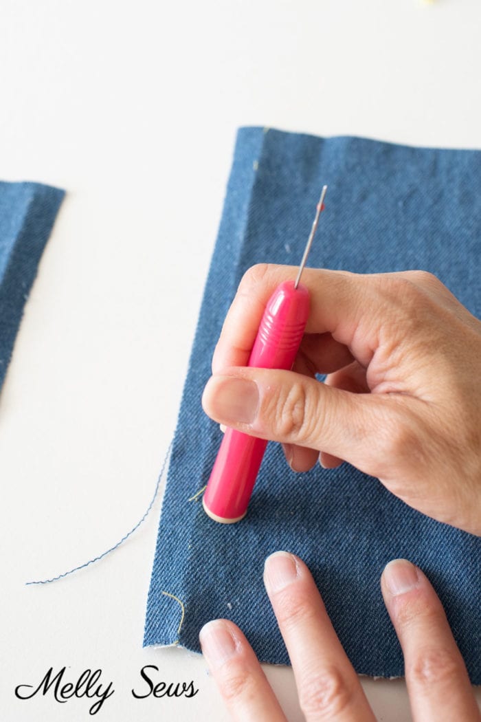 The end of this seam ripper helps take out tiny left behind threads