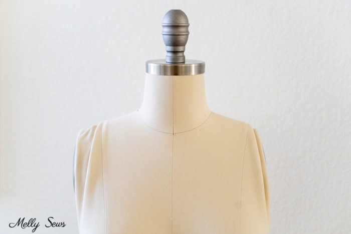 Mannequin with collapsible shoulders to make dressing easier