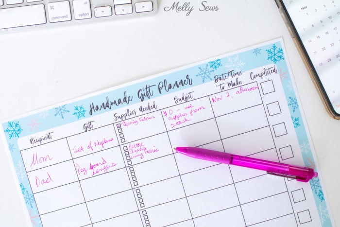 Handmade Holiday Gift Planner - partially filled in with pink ink pen writing DIY gift ideas to make for Christmas