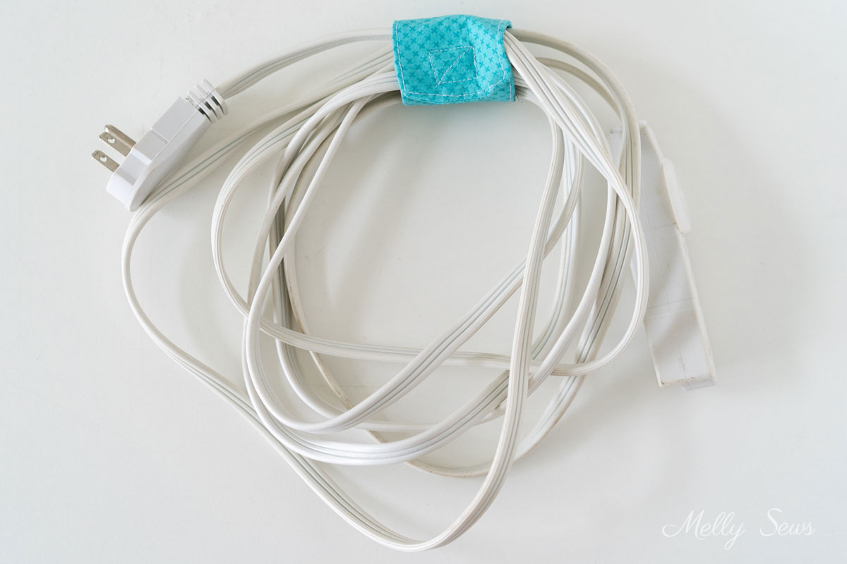 Blue cord keeper on an extension cord