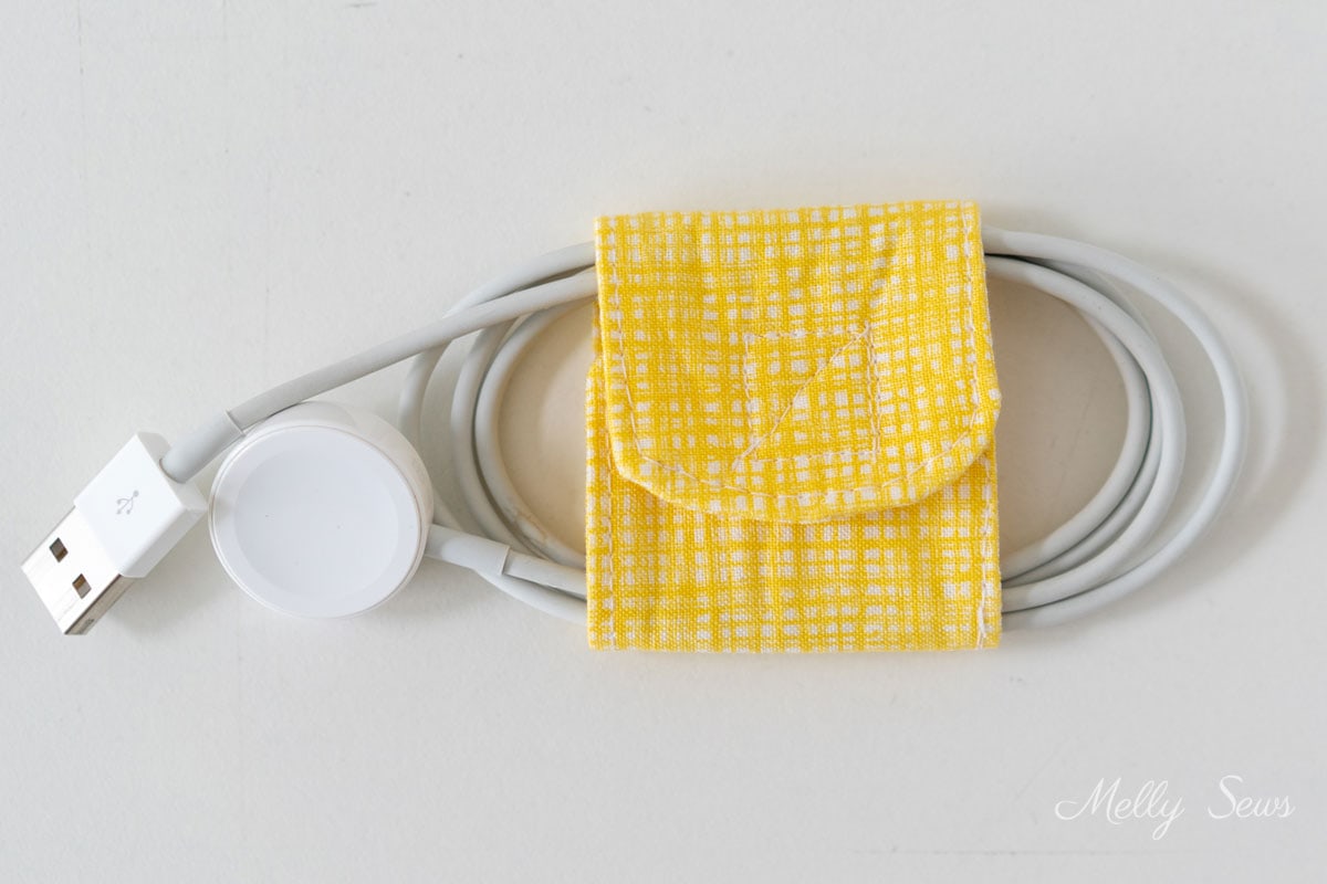 Yellow cord wrapper on an Apple Watch charger