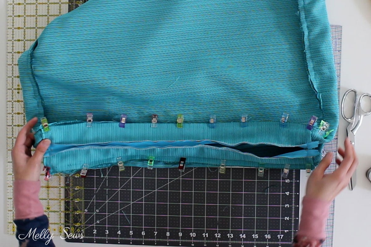 Sew the side of a couch cushion cover with a zipper