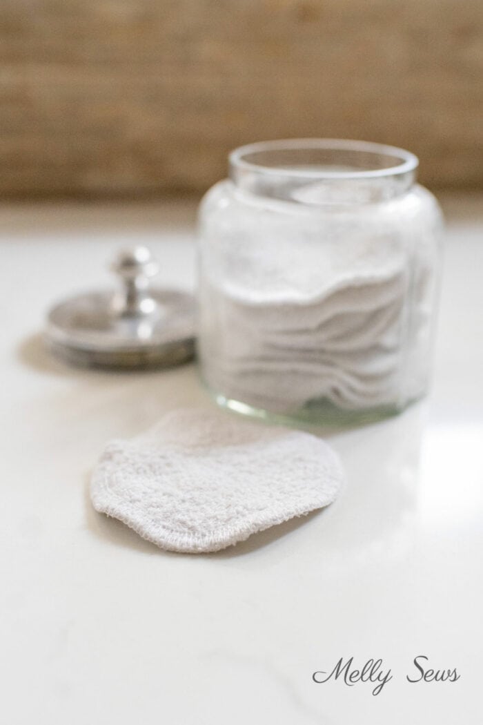 Makeup wipes sewn from an old towel stored in a glass jar
