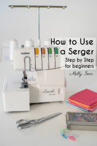 How to use a Serger - image of a Brother serger with fabric, scissors and clips nearby