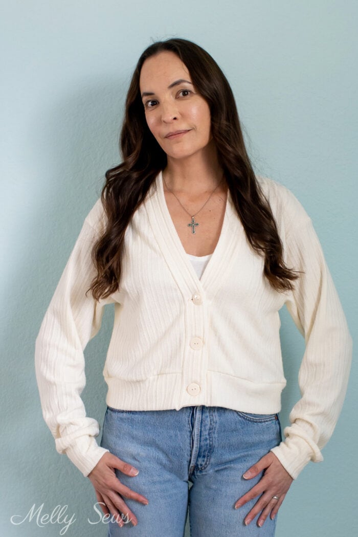 Brunette woman wearing a cardigan she sewed for herself