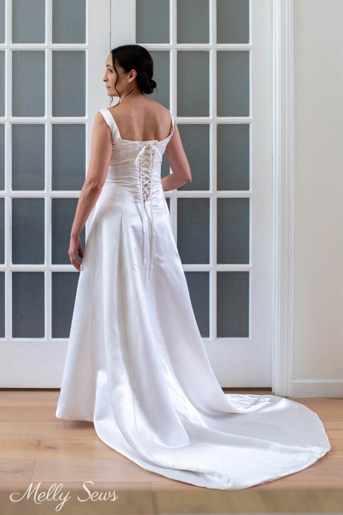 Woman in a wedding dress with a corset back lacing instead of a zipper