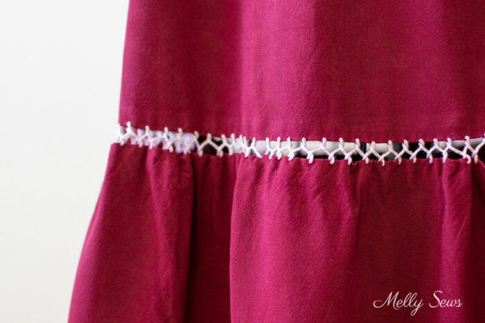 Close up of a fagoting or decorative bridge stitch on a skirt
