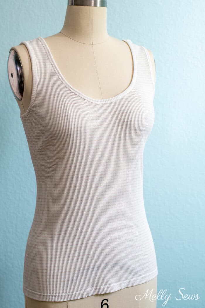 A stretchy knit fabric tank on a dress form