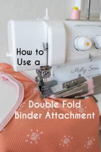 How to use a double fold binder attachment - binder attached to a coverstitch machine with pink binding being sewn onto an orange top