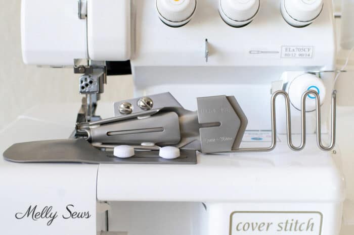 Coverstitch binder attachment on a cover stitch machine