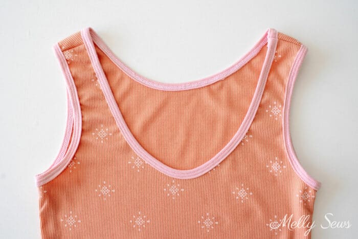 Terra cotta colored tank top with pink trim