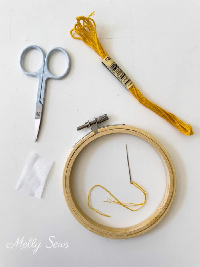 Hand embroidery supplies - scissors, floss, fusible interfacing, small hoop, needle