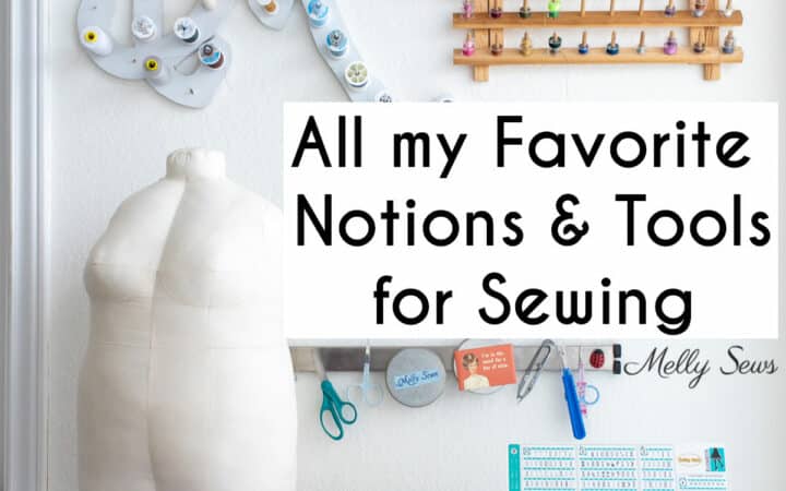 A sewing room with thread racks on the wall, a half scale dress form, a sewing machine and may sewing notions with text All My Favorite Notions and Tools for Sewing