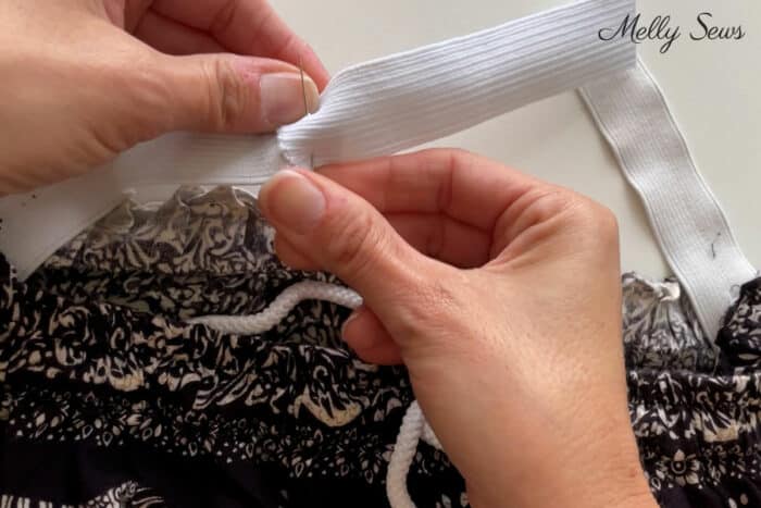 Pinning an elastic extension into a waistband