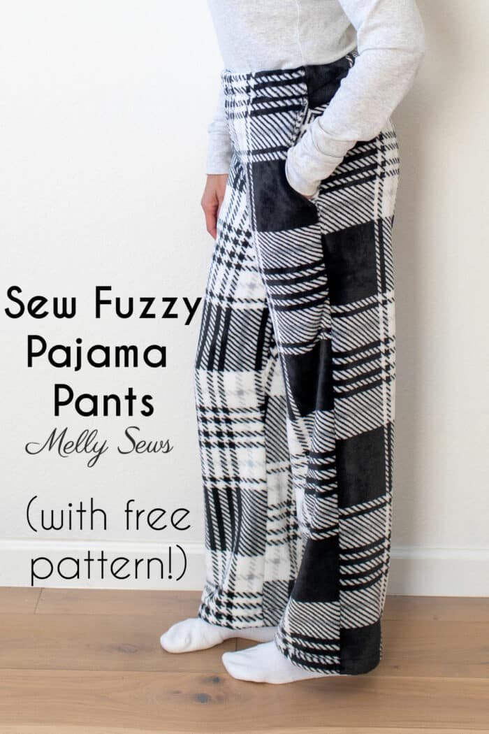 Lower half of a woman standing with her legs clad in plaid fleece pj pants and her hand in her pocket with text Sew Fuzzy Pajama Pants (with free pattern)