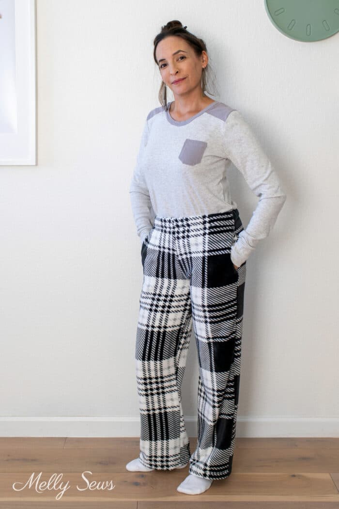 Woman wearing fuzzy pajama pants she made