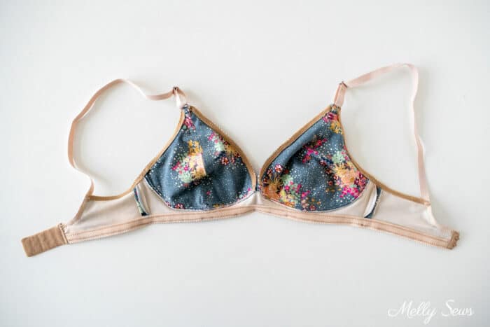Inside of a gray floral bra showing matching lining