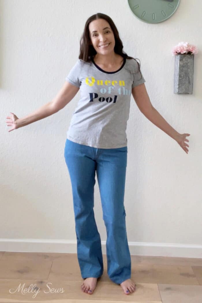 Brunette woman wearing a t-shirt and jeans that she sewed for herself