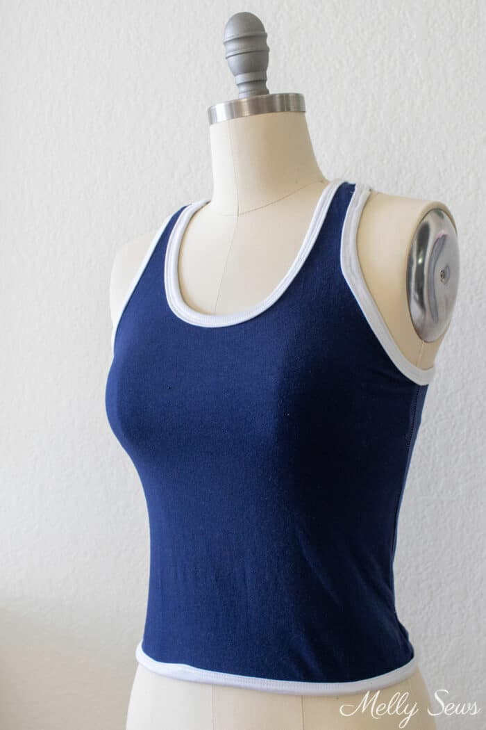 Navy blue tank top with contrasting white neckband and armbands